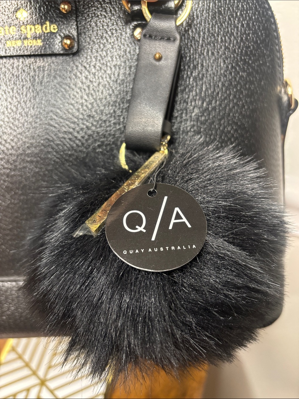 QUAY AUSTRALIA LARGE BLACK POM POM KEYCHAIN/BAG CHARM W/GOLD ACCENTS